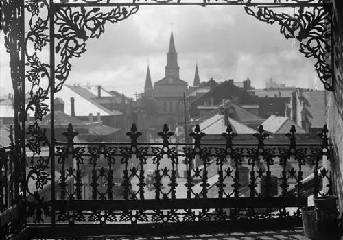 1920s-view-of-st-louis-cathedral-through-a-balcony